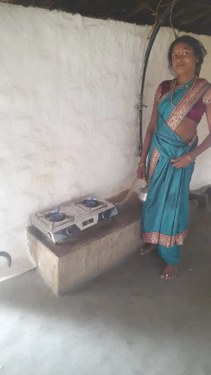 Woman standing next to a small electronic device